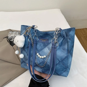 Quilted denim tote bag with chain strap and pearl charm in dark blue finish