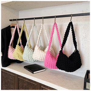 Showcase of colorful pleated bubble shoulder bags in six vibrant colors for women