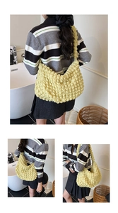 Detailed view of yellow puffy textured hobo bag with unique 3D bubble fabric