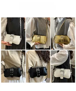 Crocodile embossed shoulder bags in white, gold, and black with large metal buckles