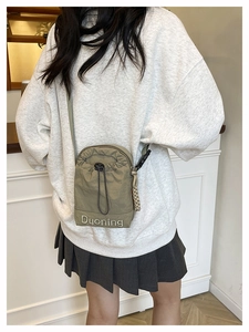 Khaki oxford cloth crossbody bag with drawstring closure and Duoning letter embroidery