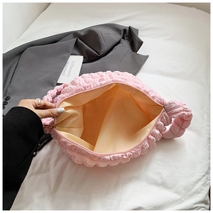 Pink bubble cloud bag interior view showing beige lining and large storage capacity