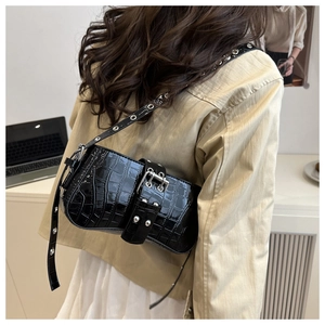 Back view of black croc-embossed shoulder bag with silver studs and grommet strap