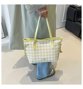 Detail of yellow and white checkered tote bag featuring side drawstrings and logo print