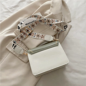 Minimalist beige and green leather crossbody bag with vintage floral wide shoulder strap