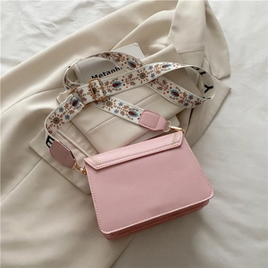 Pink rectangular crossbody bag with ethnic floral embroidered wide shoulder strap