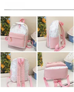 Vue détaillée sous quatre angles du sac à dos scolaire rose et blanc avec étoiles