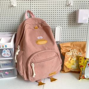 Cute pink corduroy duck-shaped backpack with big feet and embroidered eyes for school and travel