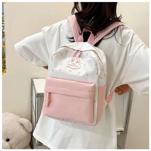 Sac à dos d'écolier rose et blanc à motifs d'étoiles avec écusson nuage en intérieur