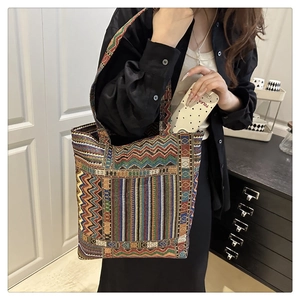 Detailed view of large ethnic canvas tote bag with colorful geometric woven pattern