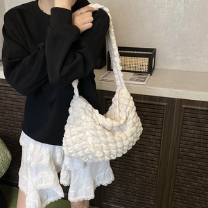 Chic white bubble textured cloud bag featuring a large pleated hobo design for women