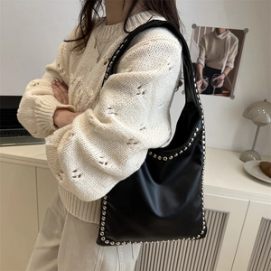 Fashionable black PU leather tote bag with silver metal studs for women's daily commute