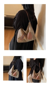Detailed view of the large tote bag showing vintage textures and leather trim details