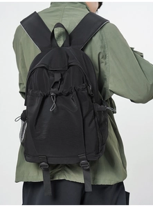Close-up of durable black nylon texture and adjustable straps on functional backpack