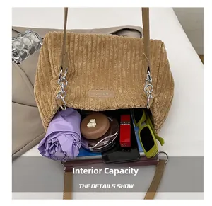 Large capacity corduroy tote bag showing interior storage for umbrella and phone