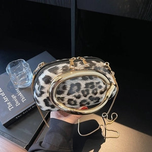 Leopard print shoulder bag with gold metal oval handle and dual zipper design
