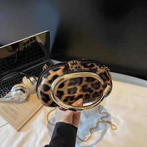 Trendy leopard print shoulder bag with gold circular handle and metal chain strap