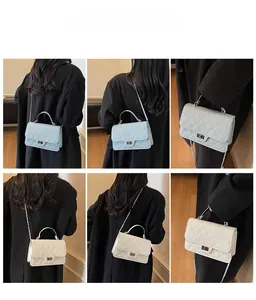 Detail showing various ways to wear the quilted chain crossbody bag in light blue and cream