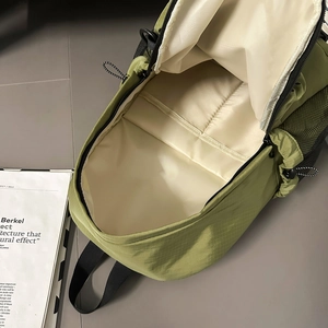 Olive green ripstop backpack with large main compartment and internal elastic sleeve