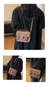 Detailansicht der braunen Retro-Umhängetasche mit Silberschnalle und Lederriemen