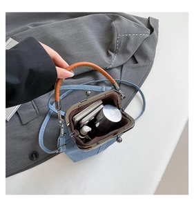 Internal view of denim doctor bag showing space for phone and cosmetics