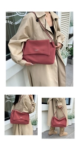 Detail of red leather tote bag with unique red and white braided chain strap accent