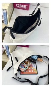 Detailed interior of the white crescent tote bag showing large storage capacity