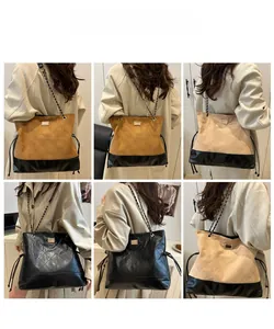 Close-up of quilted suede shoulder bags in brown, beige and black with chain straps