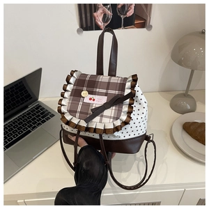 Close-up of sweet ruffled bag with star patterns and a decorative Hello Cherry label