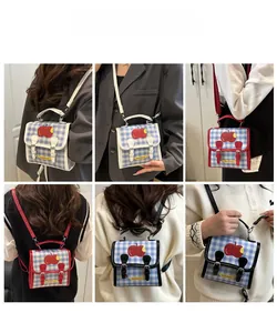 Detail of checkered mini crossbody bag with apple print showing multi-way shoulder straps