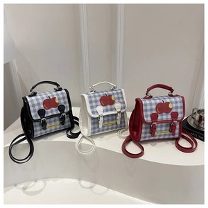 Three plaid pattern handbags with apple print in black, white, and red color options