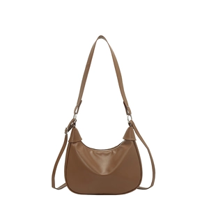 Minimalist brown matte leather hobo bag with adjustable strap for daily commute