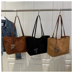 Suede tote bags in dark brown, black, and light camel showing large capacity and soft texture