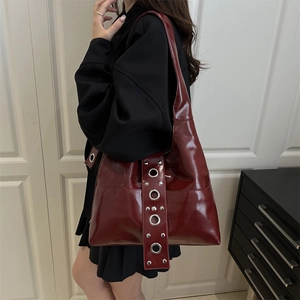 Vintage punk style burgundy faux leather tote bag with silver studs and eyelet straps