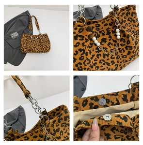 Detail view of leopard print corduroy bag showing pearl chain and magnetic closure