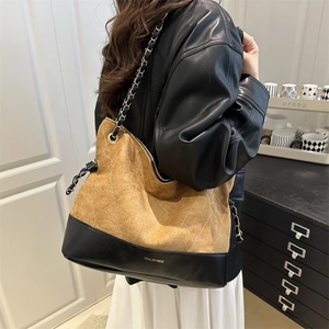 Brown quilted suede tote bag with chain strap and leather patchwork design