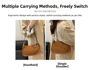Detail of a brown snakeskin pattern hobo shoulder bag with a gold metal zipper