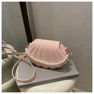 Pink shell handbag with pearl strap and snake pattern texture on white pedestal