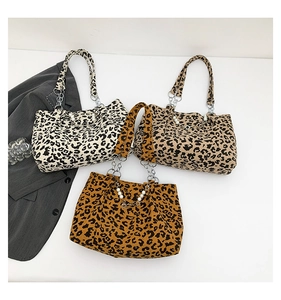 Detailed corduroy texture and leopard print patterns on tote bags with pearl chains