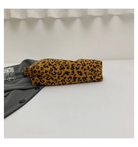 Detailed view of leopard print corduroy tote bag showing textured fabric and stitching