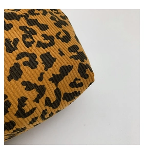 Detailed macro view of the leopard print ribbed fabric texture of this tote bag