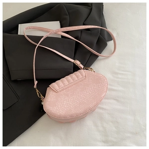 Pink shell-shaped crossbody bag featuring snake embossed texture and pearl charm detail