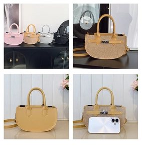 Detail view of mini half-moon Kelly bags in pink, brown, silver, and black finishes