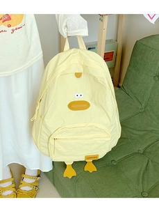 Detail of cute yellow duck backpack in lightweight nylon with 3D beak and webbed feet