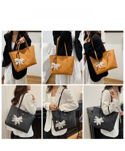 Fashionable Tyvek tote bag featuring large capacity with a 3D floral charm accessory