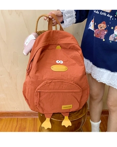 Detail of cute orange duck backpack with 3D features and multi-pocket functional design