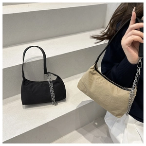 Detailed view of simple nylon hobo bags in black and khaki with silver metal chains