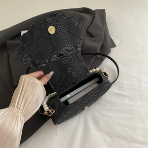 Chic black snake print shell bag with pearl shoulder strap and golden magnetic clasp