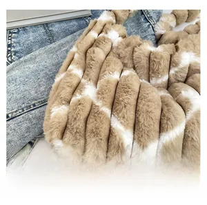 Close-up of khaki and white striped faux fur texture on a large soft tote bag