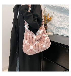 Detailed close-up of pink and white checkered plush tote bag with soft faux fur texture